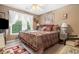 Cozy bedroom with a comfortable bed, soft lighting, and a window view, offering a peaceful retreat at 580 River Valley Dr, Dacula, GA 30019