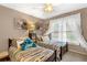 bedroom featuring twin beds, soft textures, and bright window light at 580 River Valley Dr, Dacula, GA 30019