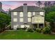Exterior view of a two-story home with a screened porch and well-manicured lawn at dusk at 580 River Valley Dr, Dacula, GA 30019