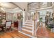 Spacious foyer with hardwood floors, staircase, and view into formal dining and living areas at 580 River Valley Dr, Dacula, GA 30019