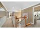 Hallway with white railings and views into other rooms, providing an open feel at 580 River Valley Dr, Dacula, GA 30019