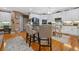 Eat-in kitchen features white cabinetry, stainless appliances, and a breakfast bar with seating at 580 River Valley Dr, Dacula, GA 30019