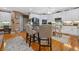 Bright kitchen featuring white cabinets, breakfast bar, and stainless steel appliances at 580 River Valley Dr, Dacula, GA 30019