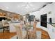 Eat-in kitchen with white cabinetry, stainless steel appliances, and hardwood floors at 580 River Valley Dr, Dacula, GA 30019
