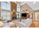 Cozy living room with stone fireplace, vaulted ceiling, and plenty of natural light at 580 River Valley Dr, Dacula, GA 30019