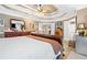 Bedroom showcasing a tray ceiling and ample natural light at 580 River Valley Dr, Dacula, GA 30019