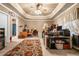 Spacious home office with multiple desks and custom ceiling, carpet, ideal for remote work and productivity at 580 River Valley Dr, Dacula, GA 30019