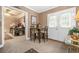 Cozy breakfast area with chairs, a table, and a view into the office, blending comfort and functionality at 580 River Valley Dr, Dacula, GA 30019