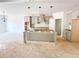 Kitchen with an island, modern gray cabinets, stainless steel hood, and pendant lighting at 1275 Pj East Rd, Covington, GA 30014