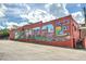 A colorful mural on the side of a building in a downtown area at 1275 Pj East Rd, Covington, GA 30014