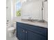 Well-lit bathroom with a vanity featuring granite countertops, undermount sink, and modern fixtures at 2477 Bobbie Dr, Marietta, GA 30066