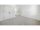Spacious bedroom with plush carpet, white walls, closet and trim, offering a clean and inviting atmosphere at 2477 Bobbie Dr, Marietta, GA 30066
