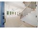 Bright, open living room with light hardwood floors, ceiling fan, and large windows for natural light at 2477 Bobbie Dr, Marietta, GA 30066