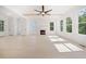Open living space with a fireplace, hardwood floors, large windows, and neutral decor at 2477 Bobbie Dr, Marietta, GA 30066