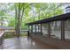 Wooden back deck overlooking a lush, green backyard at 4698 Fellsridge Dr, Stone Mountain, GA 30083