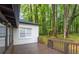 Backyard with a deck and lush trees providing privacy at 4698 Fellsridge Dr, Stone Mountain, GA 30083
