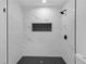 Sleek bathroom shower with black and white tile design at 4698 Fellsridge Dr, Stone Mountain, GA 30083