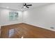 Well-lit bedroom with a window and hardwood flooring at 4698 Fellsridge Dr, Stone Mountain, GA 30083
