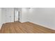 Bedroom featuring wood-style floors, white walls, and a door to another room at 4698 Fellsridge Dr, Stone Mountain, GA 30083