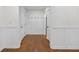 Hallway features beautiful wainscoting and hardwood floors at 4698 Fellsridge Dr, Stone Mountain, GA 30083