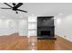 Elegant living room showcases a modern fireplace and gleaming hardwood floors at 4698 Fellsridge Dr, Stone Mountain, GA 30083