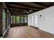 Relaxing sunroom with brick wall and lots of windows offering views of nature at 4698 Fellsridge Dr, Stone Mountain, GA 30083