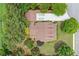Gorgeous aerial shot of a private home, with a well-manicured backyard, patio and mature trees at 221 Creekside Pass Pass, Canton, GA 30114