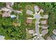 Stunning aerial view of a neighborhood with lush landscaping, multiple homes, and a community pool at 221 Creekside Pass Pass, Canton, GA 30114