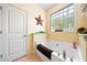 Bathroom with a soaking tub and large window allowing natural light, alongside a tiled floor at 221 Creekside Pass Pass, Canton, GA 30114