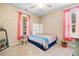 Bright bedroom featuring carpet floors, a bed, and a lot of natural light at 221 Creekside Pass Pass, Canton, GA 30114