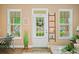 Bright entryway with views of the yard, featuring stylish decor and hardwood floors at 221 Creekside Pass Pass, Canton, GA 30114