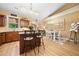 Kitchen and breakfast nook features a wooden island with granite countertops at 221 Creekside Pass Pass, Canton, GA 30114