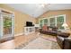 Inviting living room with a leather sofa and natural light streaming through the windows at 221 Creekside Pass Pass, Canton, GA 30114