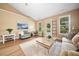 Bright living room with laminate floors, neutral colors, and multiple windows overlooking the outdoors at 221 Creekside Pass Pass, Canton, GA 30114
