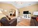 Cozy living room with a fireplace and comfortable seating at 221 Creekside Pass Pass, Canton, GA 30114