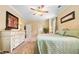 Comfortable bedroom featuring a ceiling fan, carpet floors, and a king bed with soft bedding at 221 Creekside Pass Pass, Canton, GA 30114