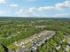 Wide aerial shot of a neighborhood bordered by dense woods, offering a serene and secluded atmosphere at 2909 Everson Ridge Ct, Snellville, GA 30039