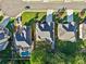Aerial shot showcases backyard pools, lush lawns, and neighborhood streets lined with well-kept homes at 2909 Everson Ridge Ct, Snellville, GA 30039