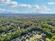 An aerial shot captures a neighborhood with beautiful homes, mature trees, and neatly landscaped lawns at 2909 Everson Ridge Ct, Snellville, GA 30039