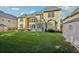 Sprawling backyard featuring a well-maintained lawn, patio area, and mature landscaping at 2909 Everson Ridge Ct, Snellville, GA 30039