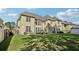 Expansive backyard with lush green lawn, patio seating, and an impressive view of the home's rear exterior at 2909 Everson Ridge Ct, Snellville, GA 30039