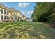 Lush backyard with a patio, storage shed, and ample green space, perfect for outdoor activities at 2909 Everson Ridge Ct, Snellville, GA 30039