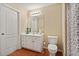 Cozy bathroom with a single sink vanity and coordinating neutral colored shower curtain at 2909 Everson Ridge Ct, Snellville, GA 30039