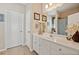 Bathroom with white vanity, decorative accents, and tiled floors creates a clean and inviting space at 2909 Everson Ridge Ct, Snellville, GA 30039