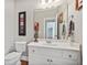 Bright bathroom with white vanity, mirror, and modern fixtures at 2909 Everson Ridge Ct, Snellville, GA 30039