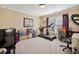 Bedroom with a treadmill, butterfly decorations, window with blinds, and a computer chair at 2909 Everson Ridge Ct, Snellville, GA 30039