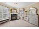 Cozy bedroom featuring a fireplace, large dresser, and soft natural light at 2909 Everson Ridge Ct, Snellville, GA 30039