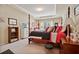 Delightful bedroom showcasing a four-poster bed, decorative accents, and bright décor at 2909 Everson Ridge Ct, Snellville, GA 30039