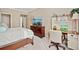 Bedroom featuring a large dresser with TV, a desk, and comfortable bed at 2909 Everson Ridge Ct, Snellville, GA 30039
