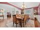Spacious dining room with large table and chairs, open to office space at 2909 Everson Ridge Ct, Snellville, GA 30039